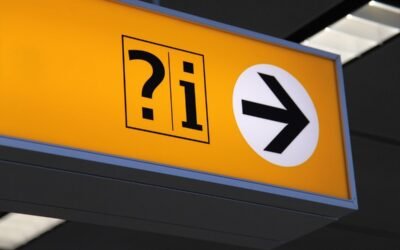Panneau jaune avec ?i dans un carré et flèche noire dans cercle blanc